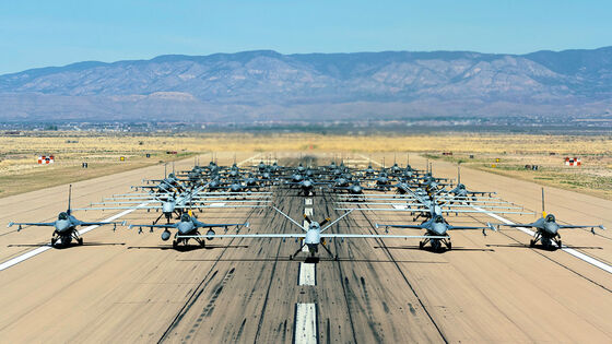 Forty-nine F-16 Vipers and MQ-9 Reapers assigned to the 49th Wing line up on the runway during an elephant walk at Holloman Air Force Base, New Mexico, April 21, 2023. Hollomans use of the Reaper marks the first time an MQ-9 participated in a display of airpower. (U.S. Air Force photo Senior Airman Antonio Salfran)
