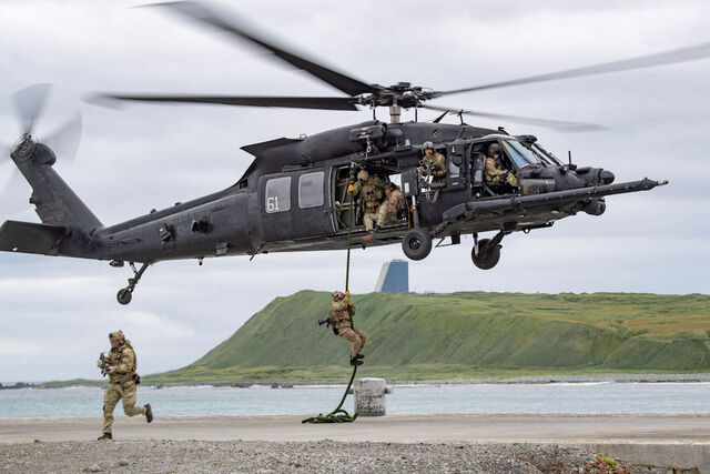 East-Coast-based U.S. Naval Special Warfare Operators (SEALs), fast-rope from a U.S. Army MH-60M, assigned to the 160th Special Operations Aviation Regiment (SOAR), at Eareckson Air station on Shemya Island, AK on Aug. 26, 2023, as part of Operation Polar Dagger. During Operation POLAR DAGGER, special operations forces will demonstrate operational reach, project the ability of U.S. forces to defend critical infrastructure, enhance all-domain awareness, and strengthen our understanding of activity in the Arctic. (U.S. Navy photo by Mass Communications Specialist 2nd Class Matthew Dickinson)